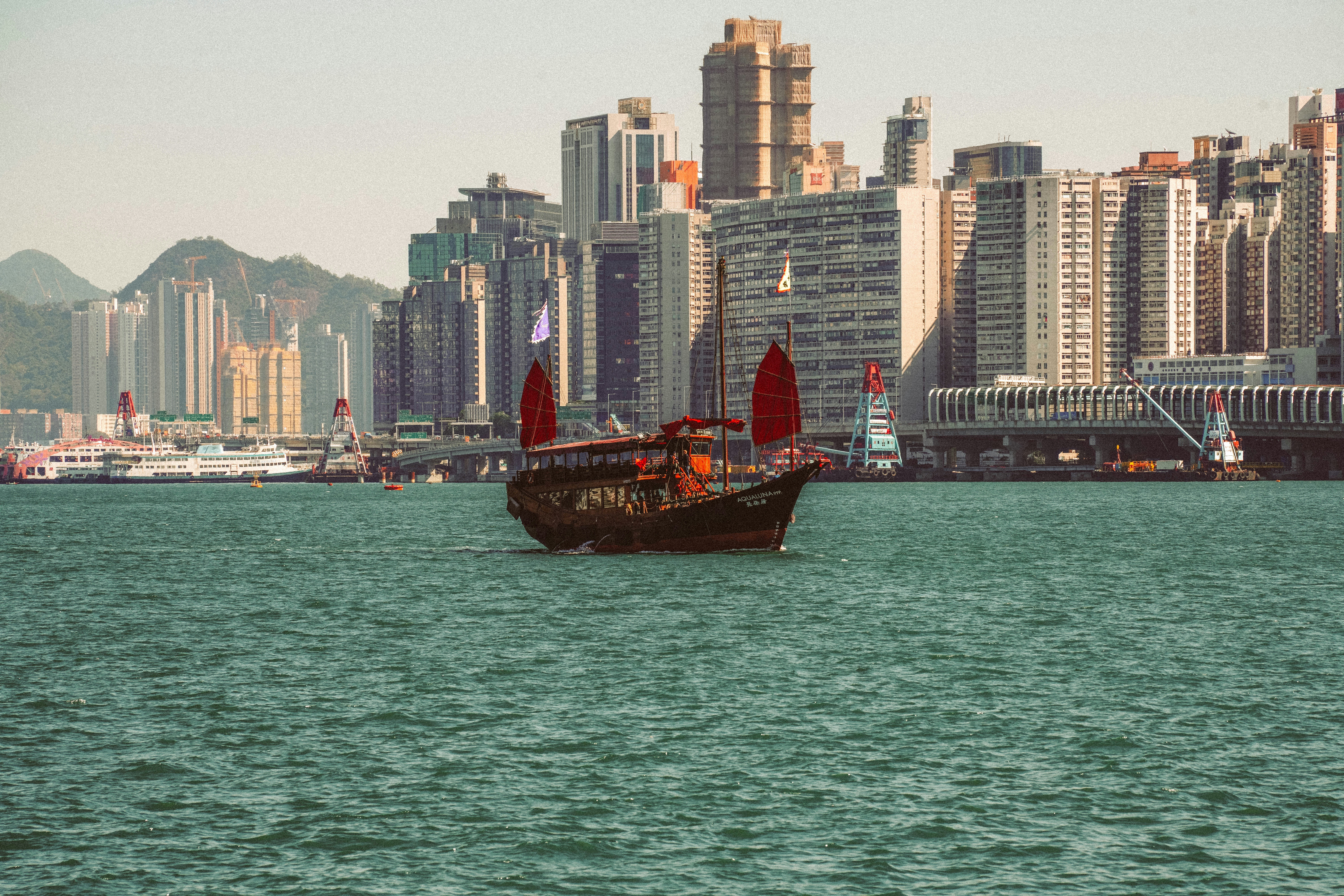 A boat in front of Hong Kong skyline